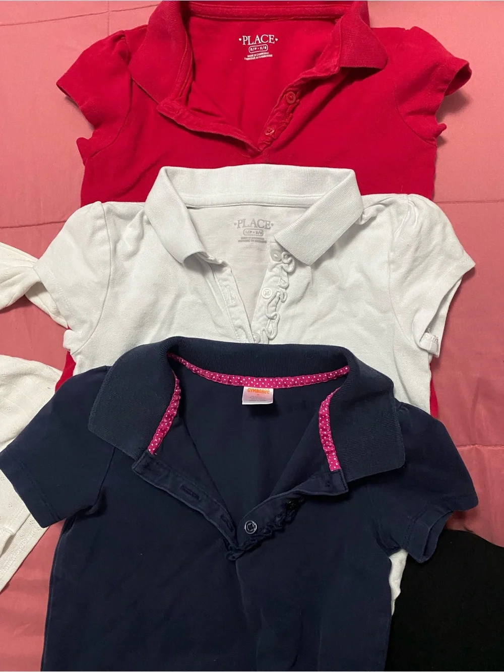 Lot of girl uniforms. Tan navy blue white and red.